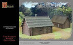 Two 1/72 scale models of Russian log houses in a natural setting for Pegasus