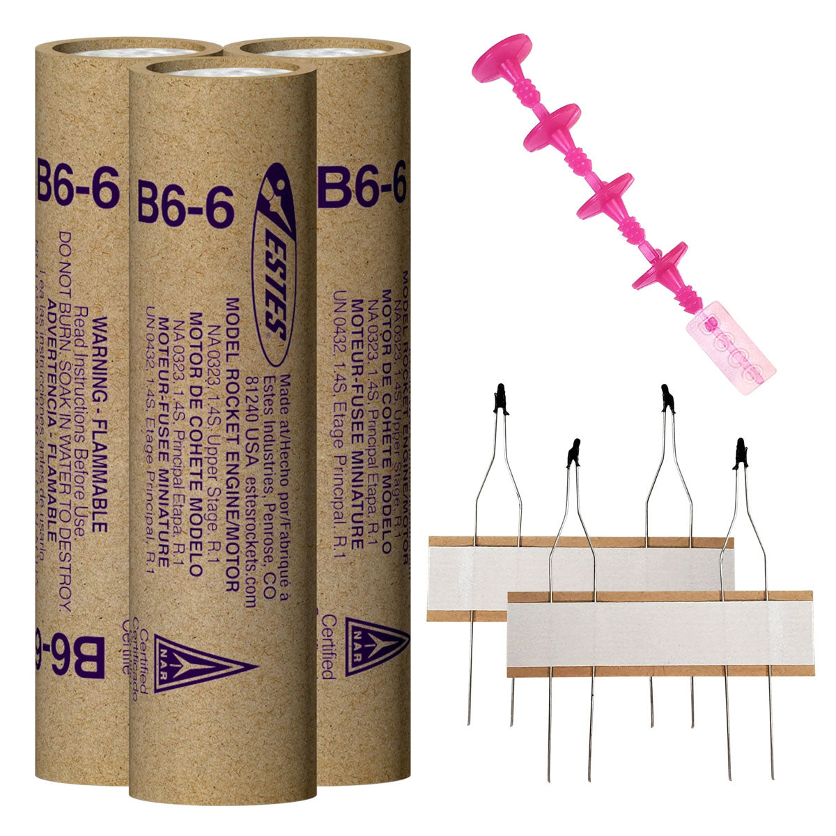 Three cardboard rocket engine tubes and a pink igniter set for Estes EST10037