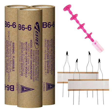 Three cardboard rocket engine tubes and a pink igniter set for Estes EST10037
