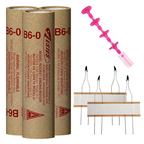 Three cardboard rocket engine tubes and a pink igniter set for Estes EST10046