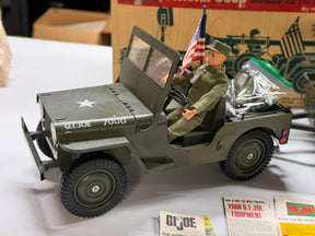 Toy jeep with action figure, set for display for Hasbro 7000