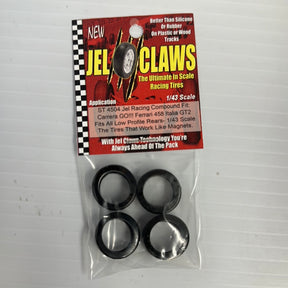 Four black slot car tires packaged with product information for Carrera GO!!! Ferrari 458 Slot Cars /43 Scale Slot Car Tire