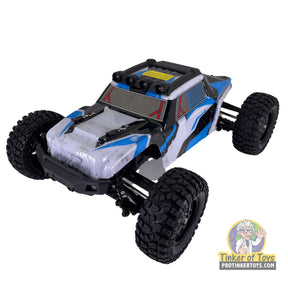 Black and blue remote control desert buggy with large off-road tires for IMEX IMX19525