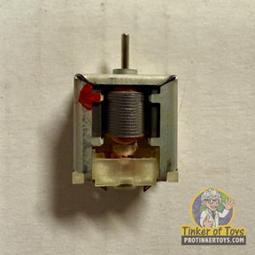 Small electric motor component with visible coil and metal casing for Tyco 6576