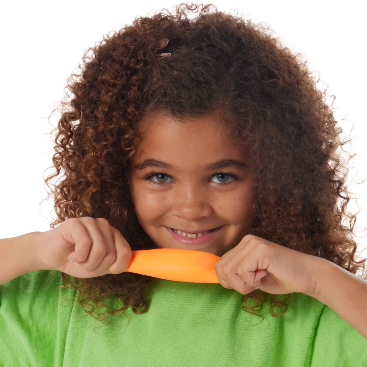 Girl pulling an orange Teenie NeeDoh