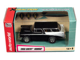 Black and white 1955 Chevy Nomad slot car toy car in its box for Auto World CP7981