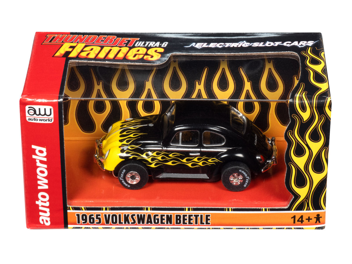 Black 1965 VW Beetle toy car with yellow flames, displayed in its box for Auto World CP7985