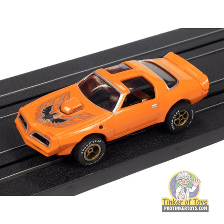1977 Pontiac Firebird (Orange) 5B | SC354 | Auto World — on-track view
