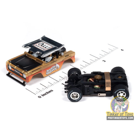 Xtraction 1972 Ford Baja Bronco (Gold with Orange Race Graphics) 1A | SC407 | Auto World — chassis and scale view