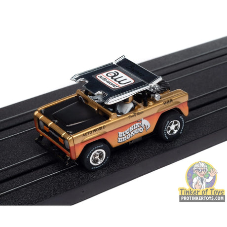 Xtraction 1972 Ford Baja Bronco (Gold with Orange Race Graphics) 1A | SC407 | Auto World — on-track view