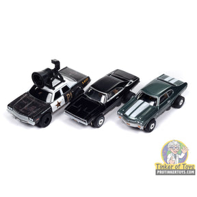 Three slot car toy cars: a black and white vehicle, a black sedan, and a dark green car for Auto World SC409