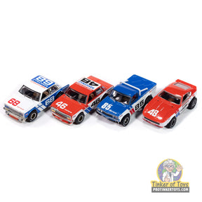 Four slot car race cars: white, red, blue, and red for Auto World SC420, front view
