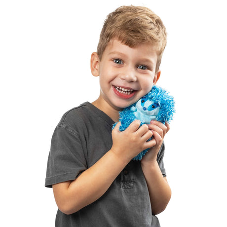 Boy smiling and hugging Curlimals Blue Badger