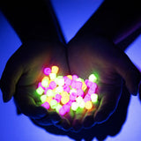 Brite Ball caps in hands glowing