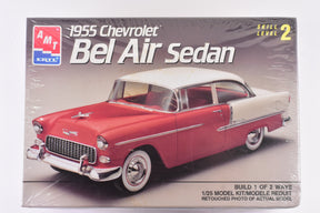 Red and white 1955 Chevrolet Bel Air Sedan model kit box art for AMT 6771