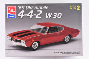 Red 1969 Oldsmobile 4-4-2 model kit box art for AMT 6538