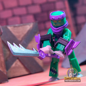 Green and purple Stikbot figure with a glowing blue weapon for SB260RA