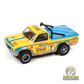 Yellow Datsun 620 pickup toy truck with "LOWE DIE-CRUSTING" decal for Auto World SC393