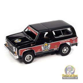 Black and red 1977 Chevrolet Blazer toy car with "185" decal for Auto World SC393