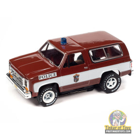 Red and white toy police SUV, 1977 Chevy Blazer, Palm Beach Florida for Auto World SC397
