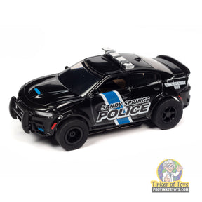 Black toy police car with "Sandy Springs Police" lettering for Auto World SC397