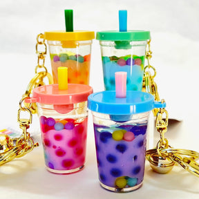Three colorful boba key charms with straws and dangling gold chains for Bcmini 12093