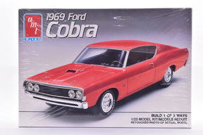 Red 1969 Ford Cobra model kit box art showing the car for AMT 6893