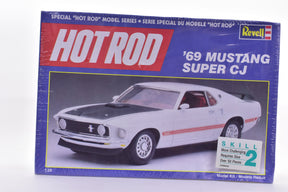Model kit box art showing a white 1969 Mustang Super CJ car model for Revell Models 7121