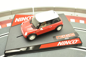 Red Mini Cooper toy car on a black and red track base for Ninco 50275