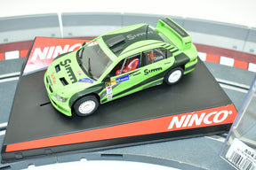 Green race car model on a black and red track base for Ninco 50436