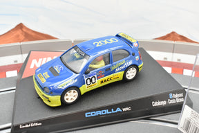 Blue and yellow toy race car, Toyota Corolla WRC, on display base for Ninco 50202