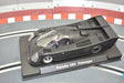 Black model car of the Porsche CK5 Prototype on a display base for Fly Slot 060301
