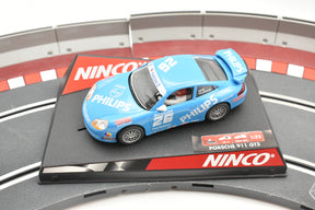 Blue Porsche GT3 race car on a track base with "PHILIPS" branding for Ninco 50242