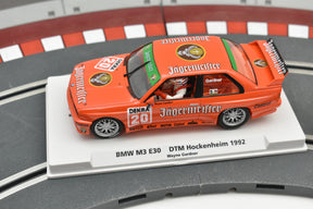 Orange BMW M3 E30 race car model on a track base for Fly Car Biker’s In Car 01