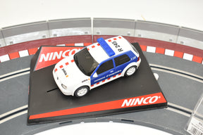 White VW Golf toy car with blue stripes, displayed on a track base for Ninco 50320