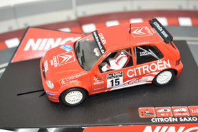 Red slot car of a Citroën Saxo race car for Ninco 50284