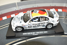 Scale model race car, BMW 320i E46, displayed on a black base for Fly Car A-621