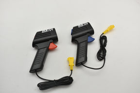 Two black hand throttles with cables and connectors on white background for SCX Compact SP2009-007
