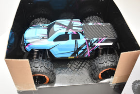 Blue and black monster truck in its open box for Blue/Yellow IMX19015