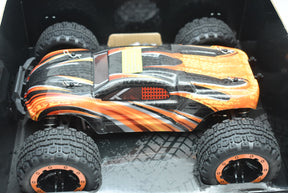 Orange and black remote-controlled monster truck ready to run for ORANGE/GREEN IMX19025, front view