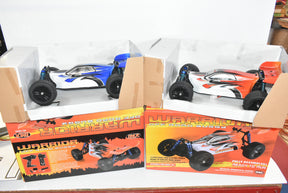 Two remote-controlled buggies displayed in open boxes with accompanying product packaging for IMEX 18020