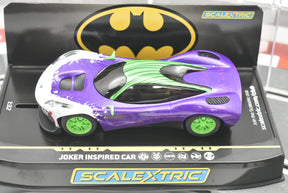 Purple and white slot car, Joker inspired model, on black display base for Scalextric C4142T