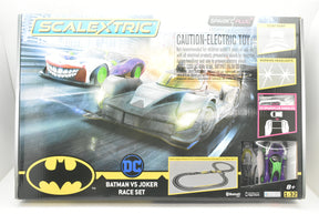 Toy car set featuring Batman and Joker race cars for Scalextric C415