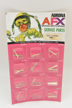 Card of 12 pick-up shoes for model cars, Aurora AFX brand for 1 card of 12