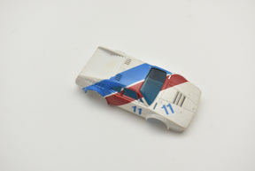 Tomy BMW M1 slot car, red, white, and blue, model #11 for Aurora / AFX / Tomy 11-1957-001