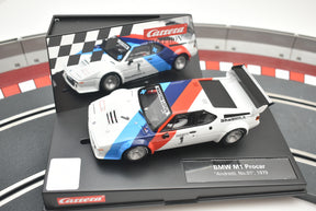 White and blue BMW M1 race car model on a track base for Carrera 27560