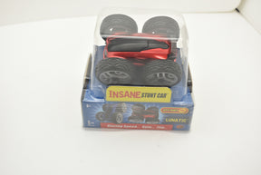Red remote-control stunt car in clear plastic packaging with wheels for 48000 48000