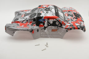 Red and black printed SC Truck body shell with small metal parts nearby for IMEX R/C parts IMX18590