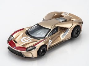 Gold and red Ford GT slot car on white background for AFX/Racemasters 22061