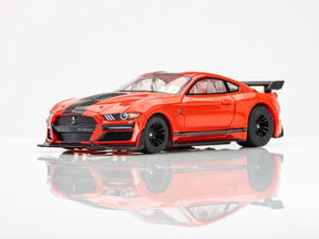 Red Shelby Mustang GT500 slot car on white surface for AFX/Racemasters 22077